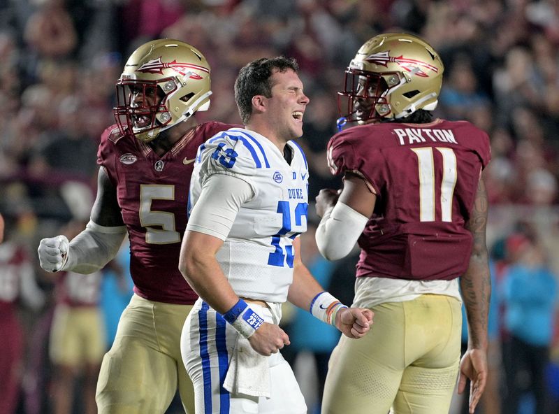 Oct 21, 2023; Tallahassee, Florida, USA; Duke Blue Devils quarterback Riley Leonard (13) leaves the game with an injury during the second half against the Florida State Seminoles at Doak S. Campbell Stadium. Mandatory Credit: Melina Myers-USA TODAY Sports