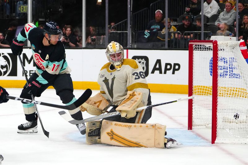 Mar 21, 2024; Las Vegas, Nevada, USA; Seattle Kraken center Jaden Schwartz (17) deflects the puck past Vegas Golden Knights goaltender Logan Thompson (36) to score a goal during the third period at T-Mobile Arena. Mandatory Credit: Stephen R. Sylvanie-USA TODAY Sports