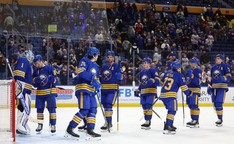 Jan 14, 2026; Buffalo, New York, USA;  The Buffalo Sabres celebrate a win over the Philadelphia Flyers at KeyBank Center. Mandatory Credit: Timothy T. Ludwig-Imagn Images