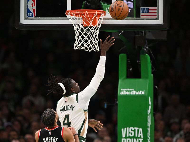 BOSTON, MASSACHUSETTS - APRIL 07: Jrue Holiday #4 of the Boston Celtics attempts a layup against the Portland Trail Blazers during the first quarter at the TD Garden on April 07, 2024 in Boston, Massachusetts. NOTE TO USER: User expressly acknowledges and agrees that, by downloading and or using this photograph, User is consenting to the terms and conditions of the Getty Images License Agreement. (Photo by Brian Fluharty/Getty Images)