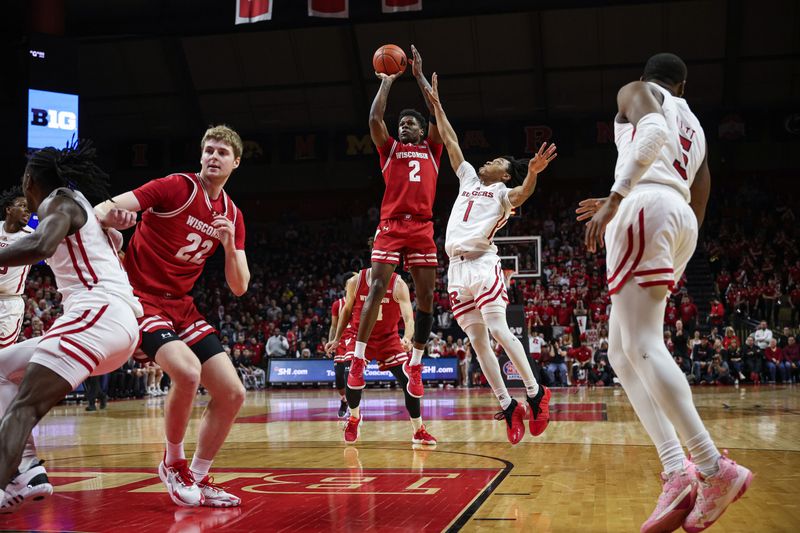 Feb 10, 2024; Piscataway, New Jersey, USA; Wisconsin Badgers guard AJ Storr (2) shoots the ball against Rutgers Scarlet Knights guard Jamichael Davis (1) during the first half at Jersey Mike's Arena. Mandatory Credit: Vincent Carchietta-USA TODAY Sports