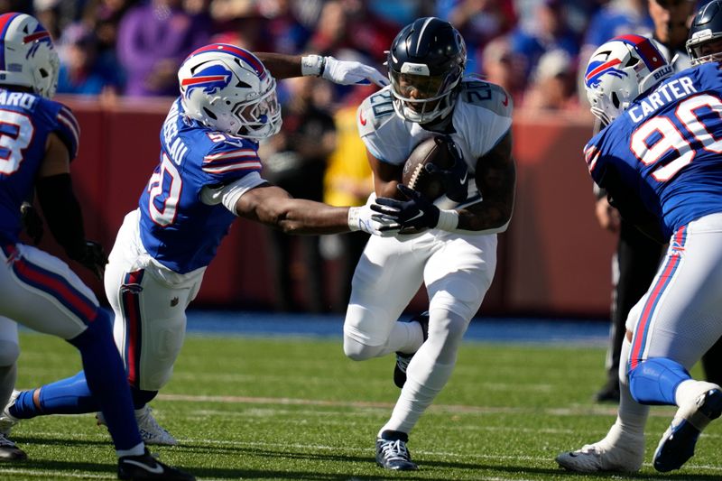 Tennessee Titans running back Tony Pollard (20) runs the ball past Buffalo Bills defensive end Greg Rousseau (50) during the first half of an NFL football game Sunday, Oct. 20, 2024, in Orchard Park, N.Y. (AP Photo/Charles Krupa)