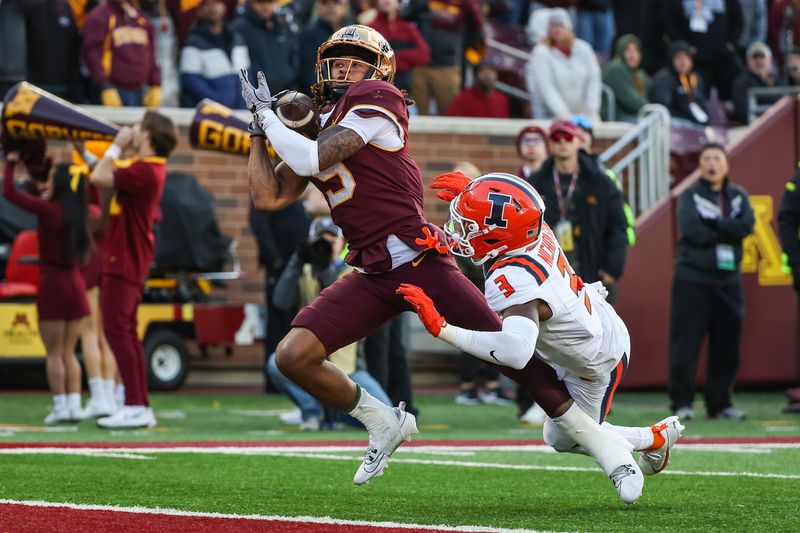 Nov 4, 2023; Minneapolis, Minnesota, USA; Minnesota Golden Gophers wide receiver Daniel Jackson (9) makes a touchdown catch while Illinois Fighting Illini defensive back Tahveon Nicholson (3) defends during the second half at Huntington Bank Stadium. Mandatory Credit: Matt Krohn-USA TODAY Sports