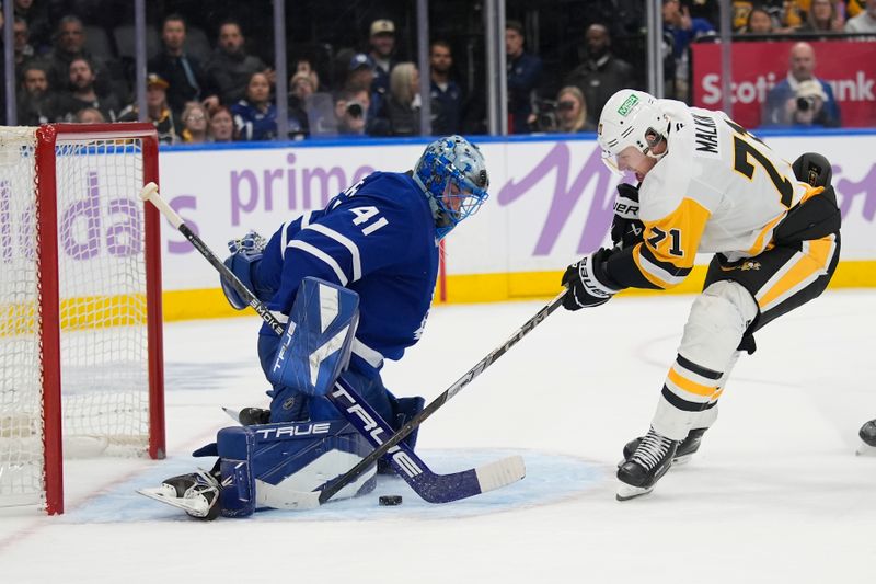 Nov 3, 2025; Toronto, Ontario, CAN; Toronto Maple Leafs goaltender Anthony Stolarz (41) makes a save on a breakaway against Pittsburgh Penguins forward Evgeni Malkin (71) during the second period at Scotiabank Arena. Mandatory Credit: John E. Sokolowski-Imagn Images