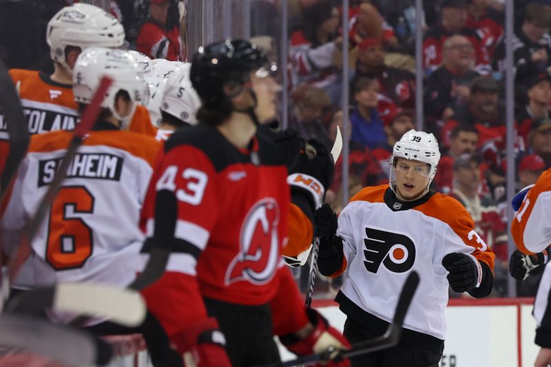 Jan 18, 2025; Newark, New Jersey, USA; Philadelphia Flyers right wing Matvei Michkov (39) celebrates his goal against the New Jersey Devils during the second period at Prudential Center. Mandatory Credit: Ed Mulholland-Imagn Images