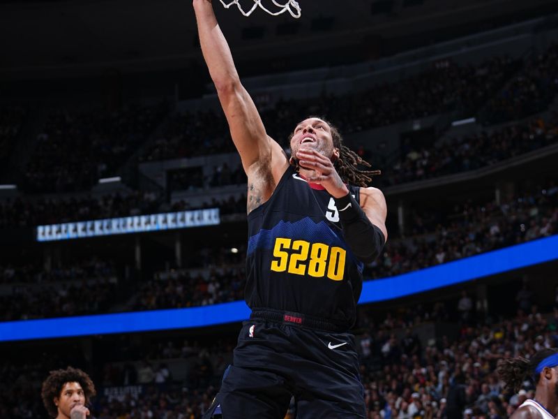 DENVER, CO - JANUARY 27: Aaron Gordon #50 of the Denver Nuggets drives to the basket during the game against the Philadelphia 76ers on January 27, 2024 at the Ball Arena in Denver, Colorado. NOTE TO USER: User expressly acknowledges and agrees that, by downloading and/or using this Photograph, user is consenting to the terms and conditions of the Getty Images License Agreement. Mandatory Copyright Notice: Copyright 2024 NBAE (Photo by Garrett Ellwood/NBAE via Getty Images)