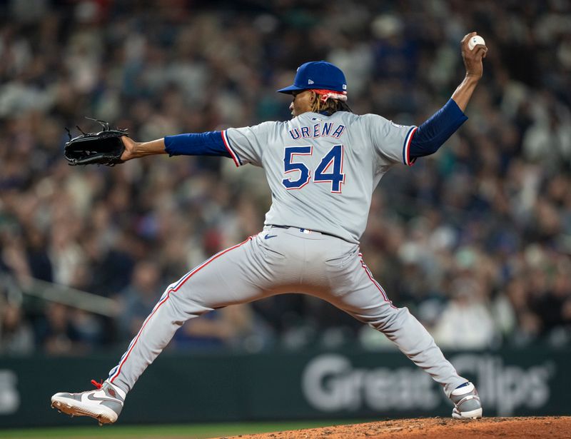 Jun 14, 2024; Seattle, Washington, USA; Texas Rangers reliever Jose Urena (54) delivers a pitch during the fifth inning against the Seattle Mariners at T-Mobile Park. Mandatory Credit: Stephen Brashear-USA TODAY Sports