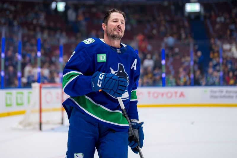 Oct 9, 2024; Vancouver, British Columbia, CAN; Vancouver Canucks forward J.T. Miller (9) smiles during warm up prior to a game against the Calgary Flames at Rogers Arena. Mandatory Credit: Bob Frid-Imagn Images