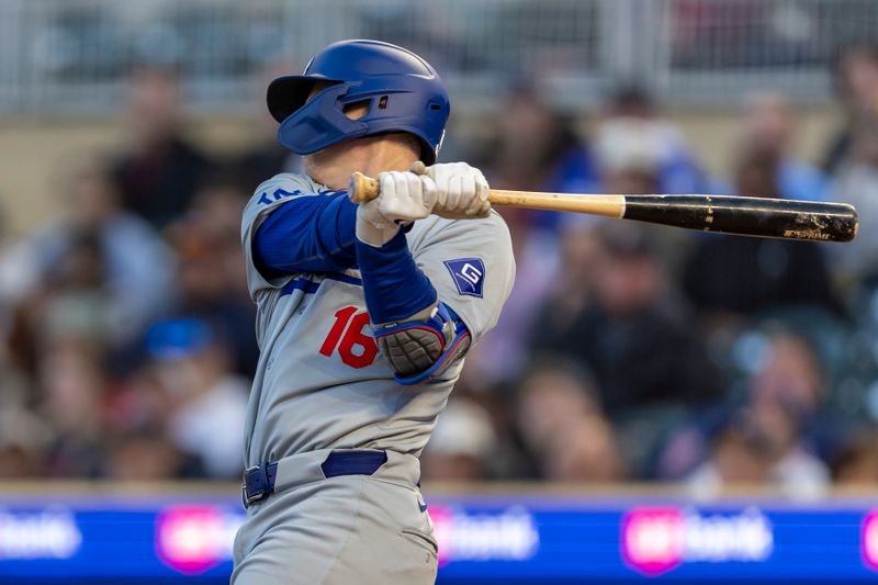 Apr 9, 2024; Minneapolis, Minnesota, USA; Los Angeles Dodgers catcher Will Smith (16) hits a single against the Minnesota Twins in the fourth inning at Target Field. Mandatory Credit: Jesse Johnson-USA TODAY Sports
