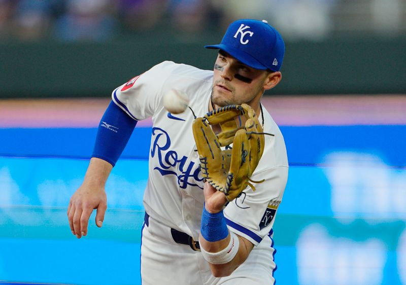 Apr 22, 2025; Kansas City, Missouri, USA; Kansas City Royals second baseman Michael Massey (19) catches a pop fly during the sixth inning against the Colorado Rockies at Kauffman Stadium. Mandatory Credit: Jay Biggerstaff-Imagn Images