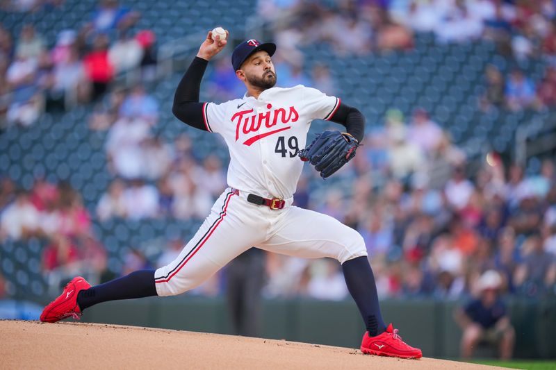 Aug 12, 2024; Minneapolis, Minnesota, USA; Minnesota Twins pitcher Pablo López (49) pitches against the Kansas City Royals in the first inning at Target Field. Mandatory Credit: Brad Rempel-USA TODAY Sports