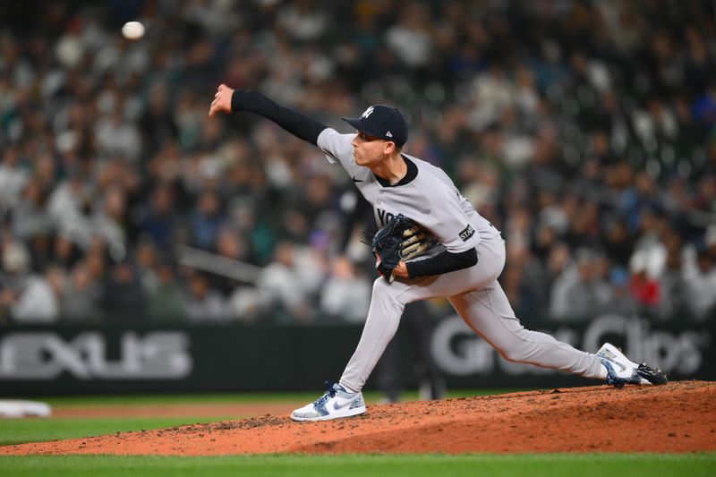 May 13, 2025; Seattle, Washington, USA; New York Yankees relief pitcher Luke Weaver (30) pitches to the Seattle Mariners during the eighth inning at T-Mobile Park. Mandatory Credit: Steven Bisig-Imagn Images