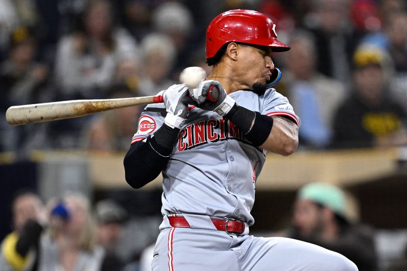 Apr 30, 2024; San Diego, California, USA; Cincinnati Reds third baseman Santiago Espinal (4) evades an inside pitch during the fifth inning against the San Diego Padres at Petco Park. Mandatory Credit: Orlando Ramirez-USA TODAY Sports