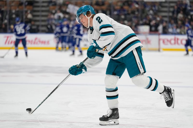 Mar 3, 2025; Toronto, Ontario, CAN; San Jose Sharks forward Will Smith (2) shoots the puck during warm up before a game against the Toronto Maple Leafs at Scotiabank Arena. Mandatory Credit: John E. Sokolowski-Imagn Images