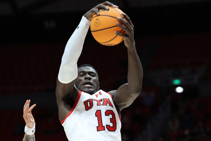 Dec 5, 2023; Salt Lake City, Utah, USA; Utah Utes center Keba Keita (13) rebounds the ball against the Southern Utah Thunderbirds during the second half at Jon M. Huntsman Center. Mandatory Credit: Rob Gray-USA TODAY Sports