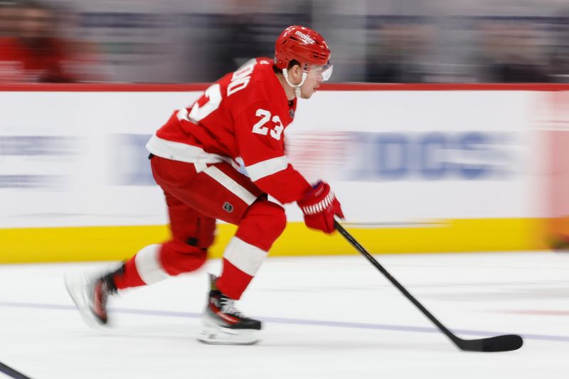 Feb 24, 2024; Detroit, Michigan, USA;  Detroit Red Wings left wing Lucas Raymond (23) skates with the puck in the third period against the St. Louis Blues at Little Caesars Arena. Mandatory Credit: Rick Osentoski-USA TODAY Sports