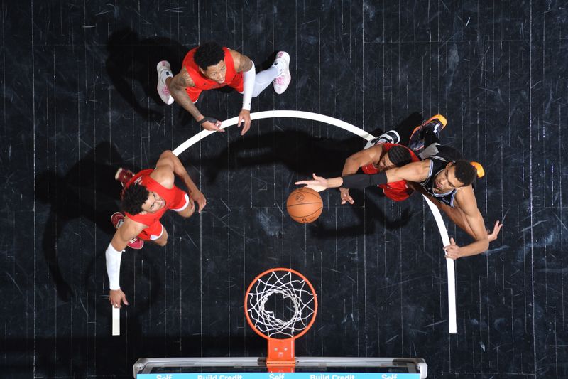 SAN ANTONIO, TX - JANUARY 26: Victor Wembanyama #1 of the San Antonio Spurs rebounds the ball during the game against the Portland Trail Blazers on January 26, 2024 at the Frost Bank Center in San Antonio, Texas. NOTE TO USER: User expressly acknowledges and agrees that, by downloading and or using this photograph, user is consenting to the terms and conditions of the Getty Images License Agreement. Mandatory Copyright Notice: Copyright 2024 NBAE (Photos by Michael Gonzales/NBAE via Getty Images)