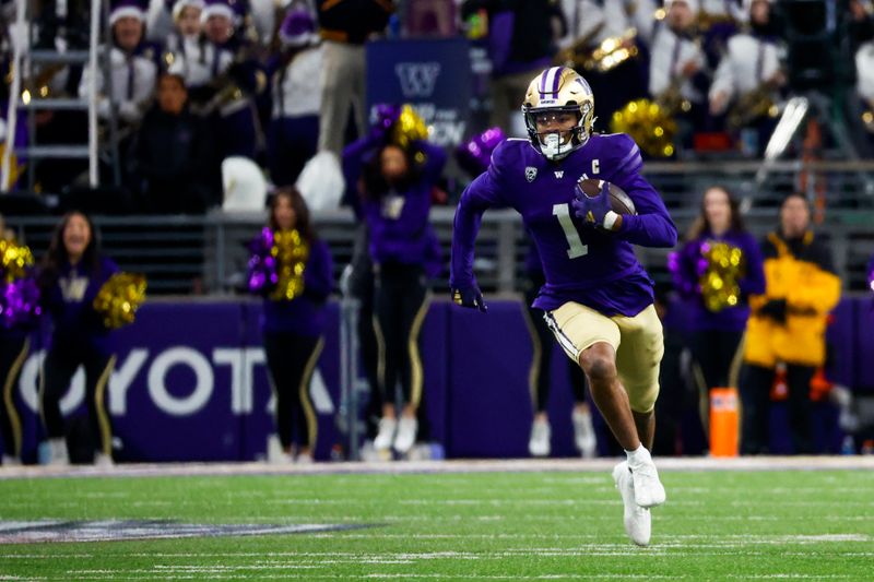 Nov 25, 2023; Seattle, Washington, USA; Washington Huskies wide receiver Rome Odunze (1) rushes against the Washington State Cougars during the fourth quarter at Alaska Airlines Field at Husky Stadium. Mandatory Credit: Joe Nicholson-USA TODAY Sports