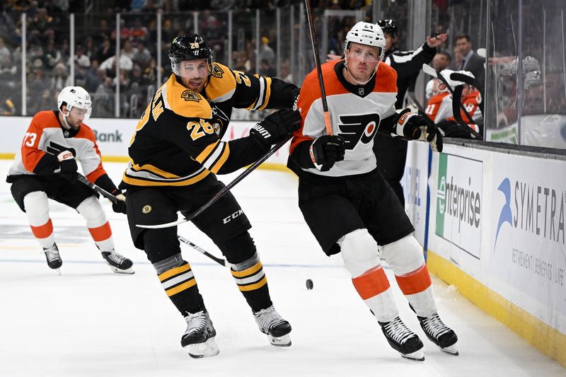 Oct 1, 2024; Boston, Massachusetts, USA; Boston Bruins center Elias Lindholm (28) defends Philadelphia Flyers defenseman Nick Seeler (24) during the second period at the TD Garden. Mandatory Credit: Brian Fluharty-Imagn Images