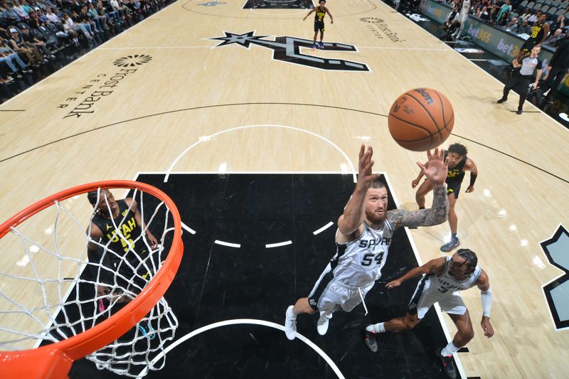 SAN ANTONIO, TX - OCTOBER 12: Sandro Mamukelashvili #54 of the San Antonio Spurs goes up for the rebound during the game against the Utah Jazz during a NBA pre season game on October 12, 2024 at the Frost Bank Center in San Antonio, Texas. NOTE TO USER: User expressly acknowledges and agrees that, by downloading and or using this photograph, user is consenting to the terms and conditions of the Getty Images License Agreement. Mandatory Copyright Notice: Copyright 2024 NBAE (Photos by Michael Gonzales/NBAE via Getty Images)