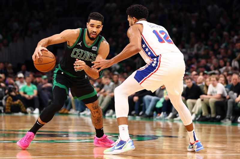 BOSTON, MASSACHUSETTS - DECEMBER 01: Jayson Tatum #0 of the Boston Celtics drives to the basket against Tobias Harris #12 of the Philadelphia 76ers during the first quarter at TD Garden on December 01, 2023 in Boston, Massachusetts. NOTE TO USER: User expressly acknowledges and agrees that, by downloading and or using this photograph, User is consenting to the terms and conditions of the Getty Images License Agreement.  (Photo by Maddie Meyer/Getty Images)