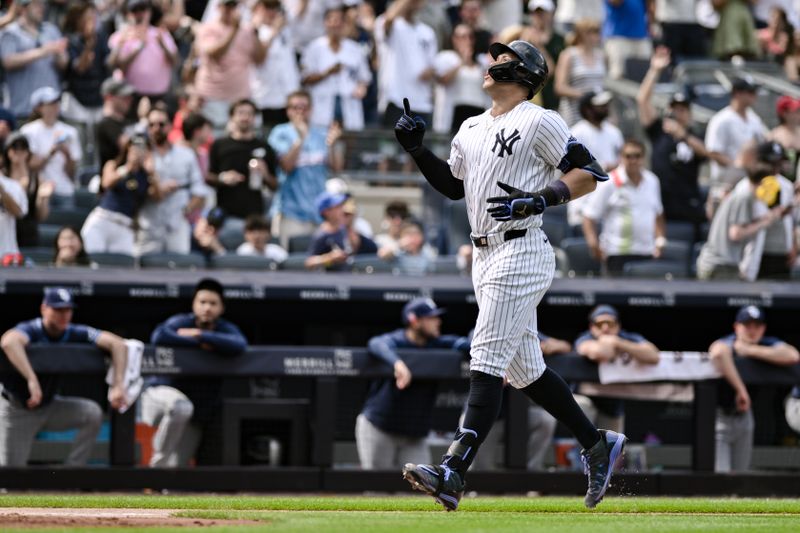 Jul 21, 2024; Bronx, New York, USA; New York Yankees outfielder Aaron Judge (99) rounds the bases after hitting a three run home run against the Tampa Bay Rays during the seventh inning at Yankee Stadium. Mandatory Credit: John Jones-USA TODAY Sports