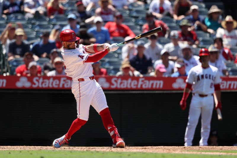 Jun 26, 2024; Anaheim, California, USA;  Los Angeles Angels shortstop Zach Neto (9) hits an RBI double against the Oakland Athletics during the sixth inning at Angel Stadium. Mandatory Credit: Kiyoshi Mio-USA TODAY Sports