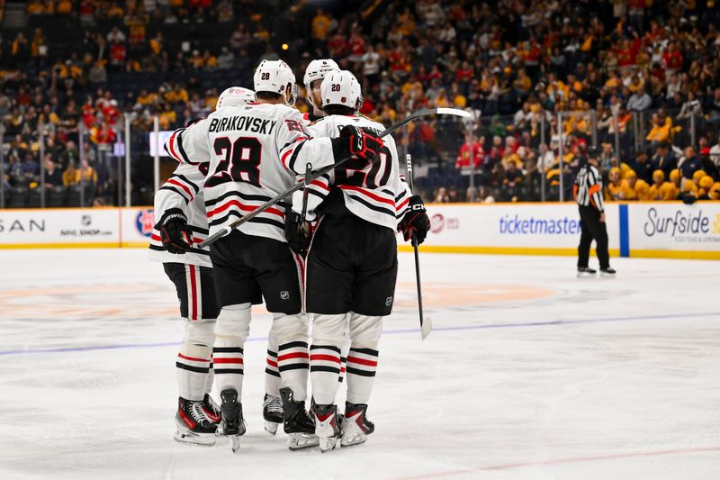 Feb 26, 2026; Nashville, Tennessee, USA;  Chicago Blackhawks center Connor Bedard (98) celebrates with his teammates after scoring a goal against the Nashville Predators during the second period at Bridgestone Arena. Mandatory Credit: Steve Roberts-Imagn Images
