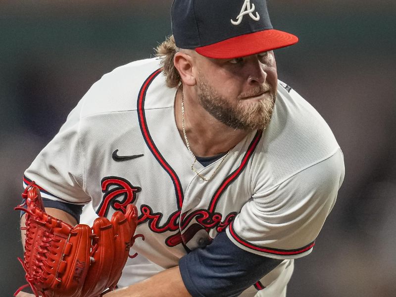 Aug 15, 2023; Cumberland, Georgia, USA; Atlanta Braves relief pitcher A.J. Minter (33) pitches against the New York Yankees during the eighth inning at Truist Park. Mandatory Credit: Dale Zanine-USA TODAY Sports