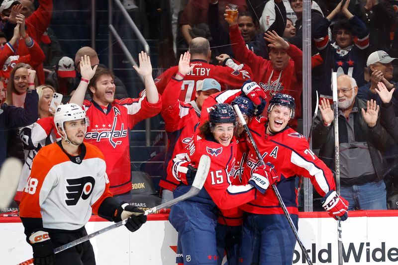 Mar 1, 2024; Washington, District of Columbia, USA; Washington Capitals center Dylan Strome (17) celebrates with teammates after scoring a goal against the Philadelphia Flyers in the third period at Capital One Arena. Mandatory Credit: Geoff Burke-USA TODAY Sports