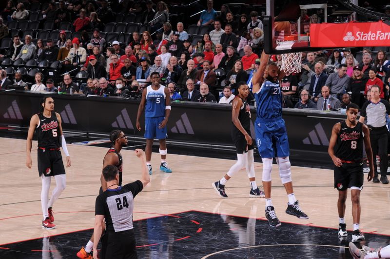 PORTLAND, OR - FEBRUARY 15: Rudy Gobert #27 of the Minnesota Timberwolves dunks the ball during the game against the Portland Trail Blazers on February 15, 2024 at the Moda Center Arena in Portland, Oregon. NOTE TO USER: User expressly acknowledges and agrees that, by downloading and or using this photograph, user is consenting to the terms and conditions of the Getty Images License Agreement. Mandatory Copyright Notice: Copyright 2024 NBAE (Photo by Cameron Browne/NBAE via Getty Images)