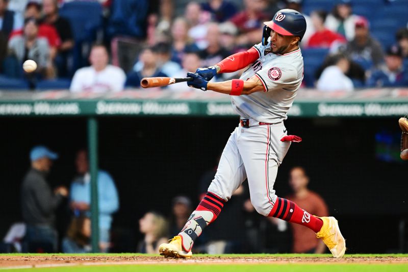 May 31, 2024; Cleveland, Ohio, USA; Washington Nationals left fielder Eddie Rosario (8) hits an RBI double during the seventh inning against the Cleveland Guardians at Progressive Field. Mandatory Credit: Ken Blaze-USA TODAY Sports