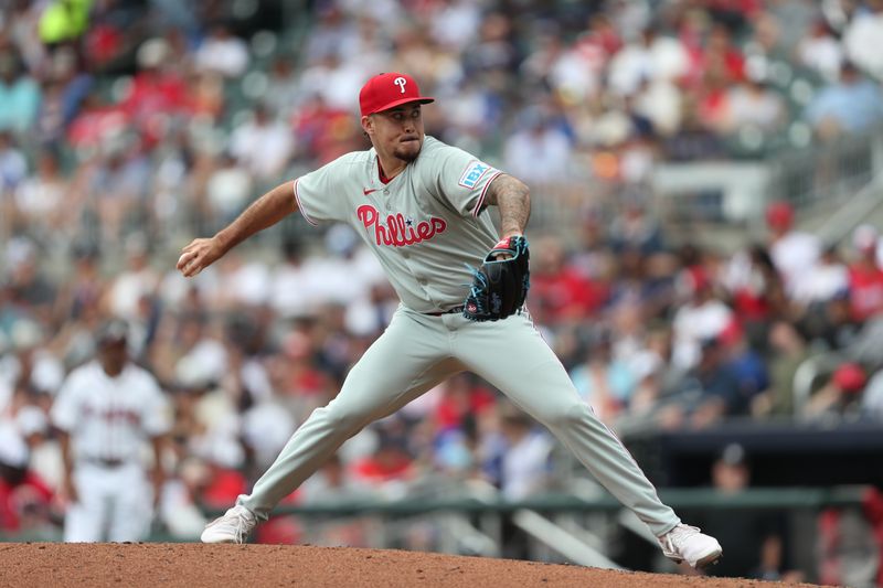 Jun 29, 2025; Cumberland, Georgia, Philadelphia Phillies relief pitcher Orion Kerkering (50) pitches during a game against the Atlanta Braves during the eighth inning at Truist Park. Mandatory Credit: Mady Mertens-Imagn Images