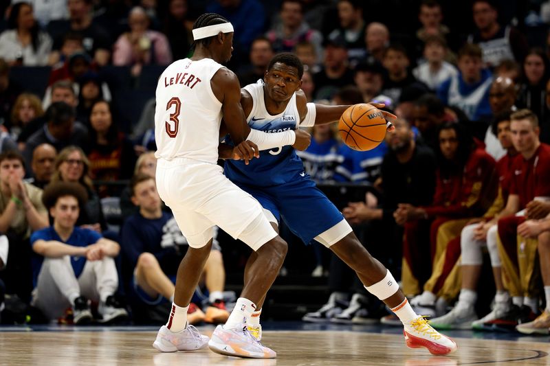 MINNEAPOLIS, MINNESOTA - MARCH 22: Anthony Edwards #5 of the Minnesota Timberwolves goes to the basket against Caris LeVert #3 of the Cleveland Cavaliers in the third quarter at Target Center on March 22, 2024 in Minneapolis, Minnesota. The Timberwolves defeated the Cavaliers 104-91. NOTE TO USER: User expressly acknowledges and agrees that, by downloading and or using this photograph, User is consenting to the terms and conditions of the Getty Images License Agreement. (Photo by David Berding/Getty Images)