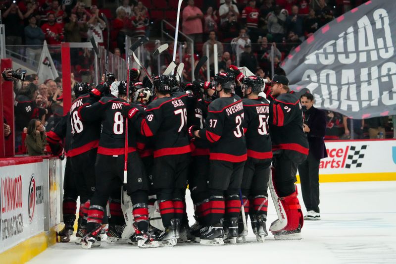 Oct 27, 2023; Raleigh, North Carolina, USA; Carolina Hurricanes players celebrates their victory against the San Jose Sharks at PNC Arena. Mandatory Credit: James Guillory-USA TODAY Sports