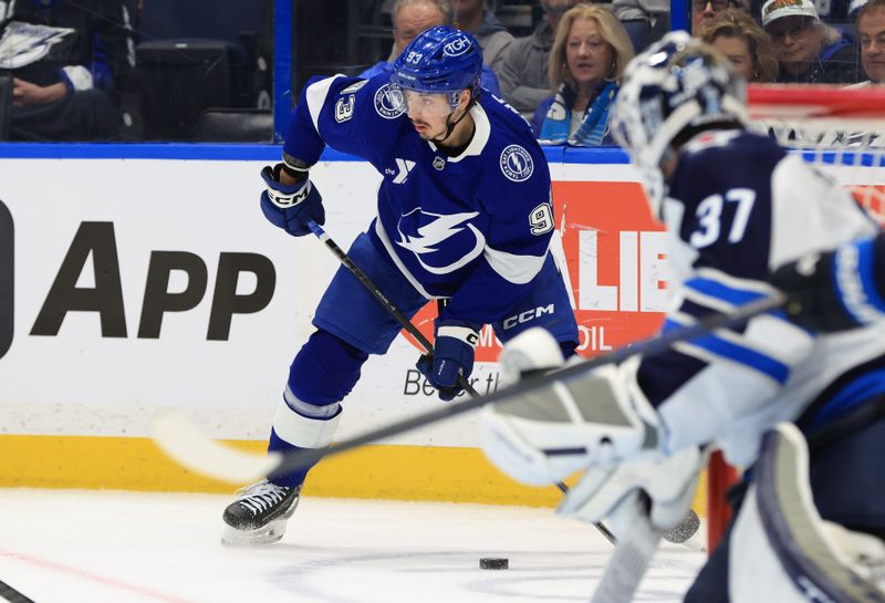 Jan 29, 2026; Tampa, Florida, USA; Tampa Bay Lightning center Gage Goncalves (93) skates with the puck as Winnipeg Jets defends during the first period at Benchmark International Arena. Mandatory Credit: Kim Klement Neitzel-Imagn Images