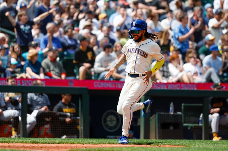 May 28, 2023; Seattle, Washington, USA; Seattle Mariners shortstop J.P. Crawford (3) scores a run against the Pittsburgh Pirates during the fifth inning at T-Mobile Park. Mandatory Credit: Joe Nicholson-USA TODAY Sports