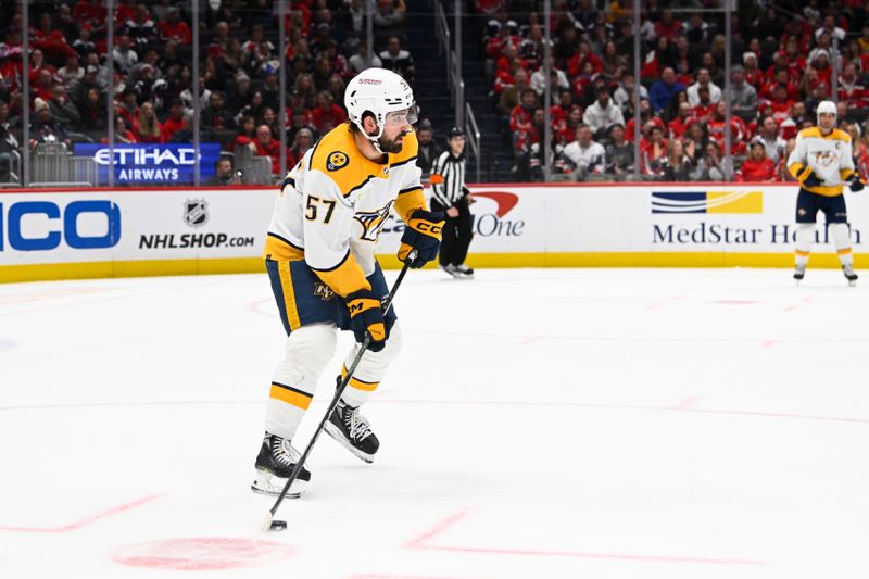 Dec 30, 2023; Washington, District of Columbia, USA; Nashville Predators defenseman Dante Fabbro (57) advances the puck /away from/ during the first period at Capital One Arena. Mandatory Credit: Brad Mills-USA TODAY Sports