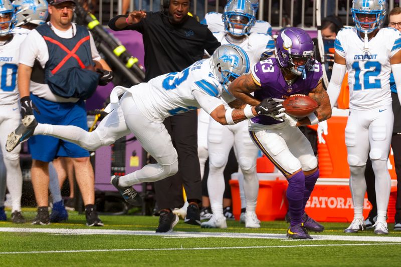 Detroit Lions cornerback Carlton Davis III (23) knocks the ball loose from Minnesota Vikings wide receiver Jalen Nailor (83) after he stepped out of bound during the second half of an NFL football game Sunday, Oct. 20, 2024, in Minneapolis. (AP Photo/Bruce Kluckhohn)