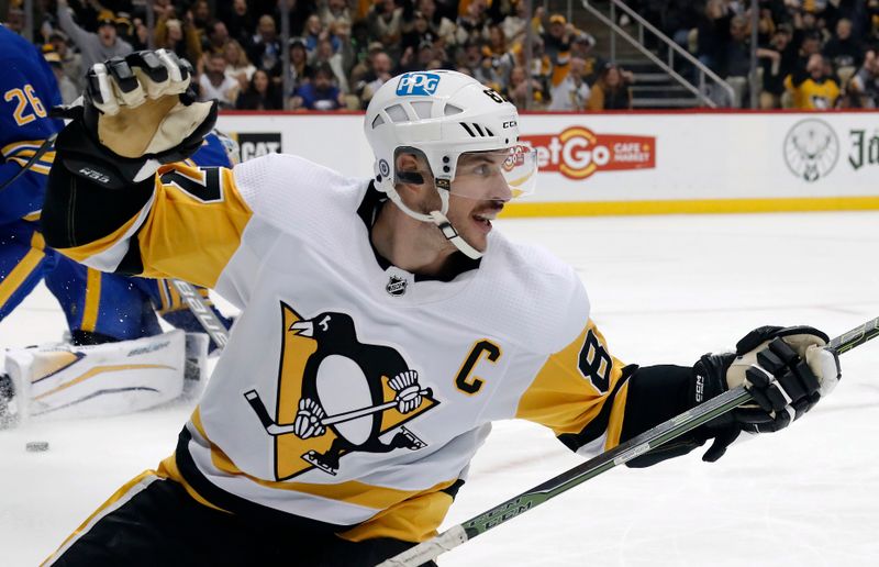 Dec 10, 2022; Pittsburgh, Pennsylvania, USA; Pittsburgh Penguins center Sidney Crosby (87) reacts after scoring a goal against the Buffalo Sabres during the third period at PPG Paints Arena. The Penguins won 3-1. Mandatory Credit: Charles LeClaire-USA TODAY Sports