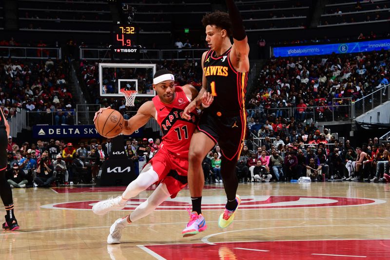 ATLANTA, GA - February 23:  Bruce Brown #11 of the Toronto Raptors drives to the basket during the game as Jalen Johnson #1 of the Atlanta Hawks plays defense on February 23, 2024 at State Farm Arena in Atlanta, Georgia.  NOTE TO USER: User expressly acknowledges and agrees that, by downloading and/or using this Photograph, user is consenting to the terms and conditions of the Getty Images License Agreement. Mandatory Copyright Notice: Copyright 2024 NBAE (Photo by Scott Cunningham/NBAE via Getty Images)