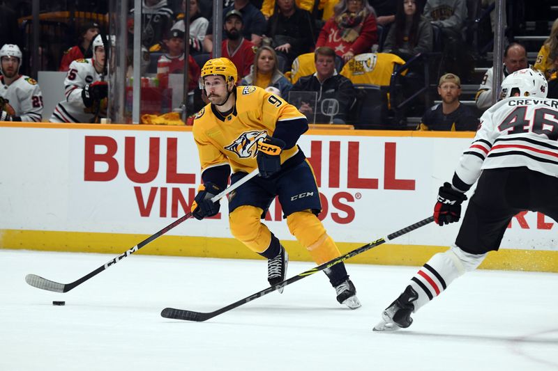 Jan 2, 2024; Nashville, Tennessee, USA; Nashville Predators left wing Filip Forsberg (9) looks to pass the puck during the first period against the Chicago Blackhawks at Bridgestone Arena. Mandatory Credit: Christopher Hanewinckel-USA TODAY Sports