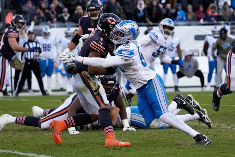 Detroit Lions linebacker Julian Okwara (99) sacks Chicago Bears quarterback Justin Fields (1) during the second half of an NFL football game in Chicago, Sunday, Nov. 13, 2022. The Lions won 31-30. (AP Photo/Nam Y. Huh)