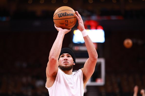 TORONTO, CANADA - NOVEMBER 29: Devin Booker #1 of the Phoenix Suns shoots the ball before the game against the Toronto Raptors on November 29, 2023 at the Scotiabank Arena in Toronto, Ontario, Canada.  NOTE TO USER: User expressly acknowledges and agrees that, by downloading and or using this Photograph, user is consenting to the terms and conditions of the Getty Images License Agreement.  Mandatory Copyright Notice: Copyright 2023 NBAE (Photo by Vaughn Ridley/NBAE via Getty Images)