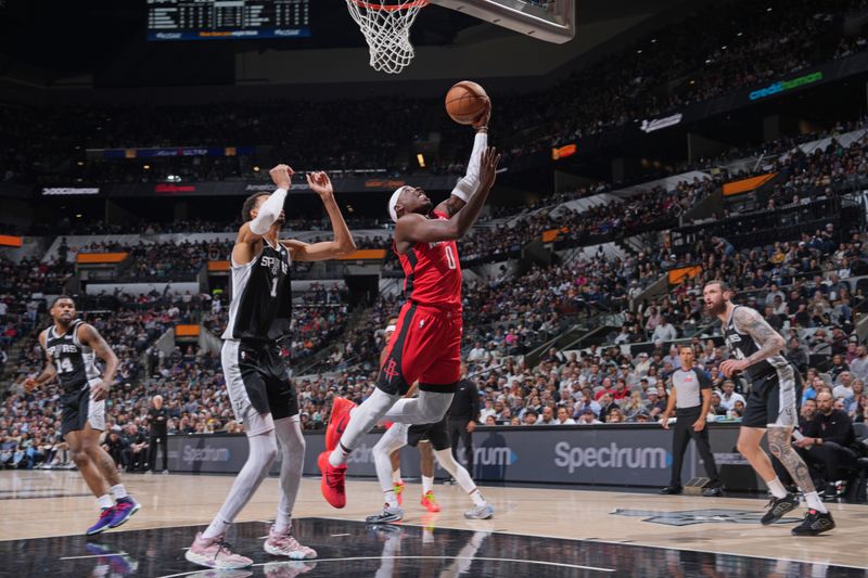 SAN ANTONIO, TX - MARCH 12: Aaron Holiday #0 of the Houston Rockets drives to the basket during the game against the San Antonio Spurs on March 12, 2024 at the Frost Bank Center in San Antonio, Texas. NOTE TO USER: User expressly acknowledges and agrees that, by downloading and or using this photograph, user is consenting to the terms and conditions of the Getty Images License Agreement. Mandatory Copyright Notice: Copyright 2024 NBAE (Photos by Jesse D. Garrabrant/NBAE via Getty Images)