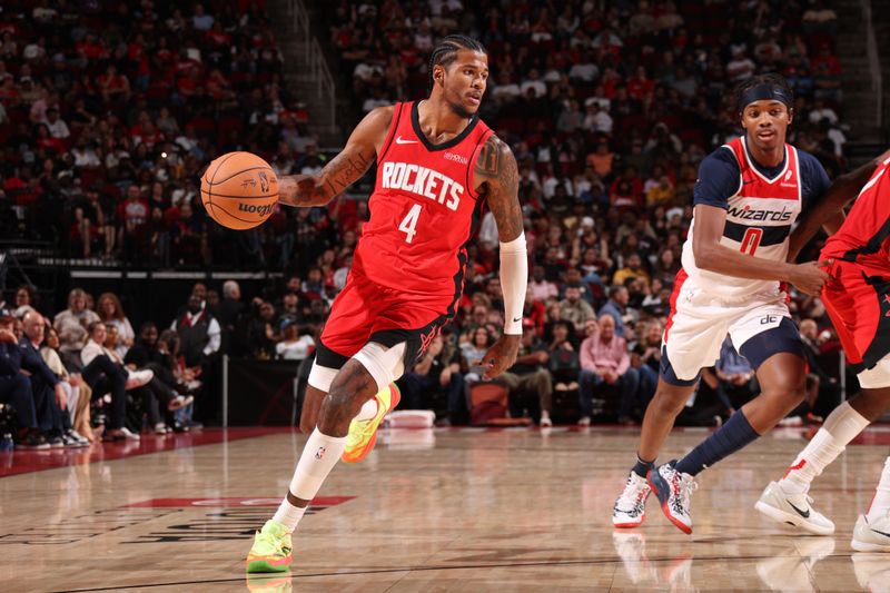 HOUSTON, TX - NOVEMBER 11: Jalen Green #4 of the Houston Rockets dribbles the ball during the game against the Washington Wizards on November 11, 2024 at the Toyota Center in Houston, Texas. NOTE TO USER: User expressly acknowledges and agrees that, by downloading and or using this photograph, User is consenting to the terms and conditions of the Getty Images License Agreement. Mandatory Copyright Notice: Copyright 2024 NBAE (Photo by KeShawn Ennis/NBAE via Getty Images)