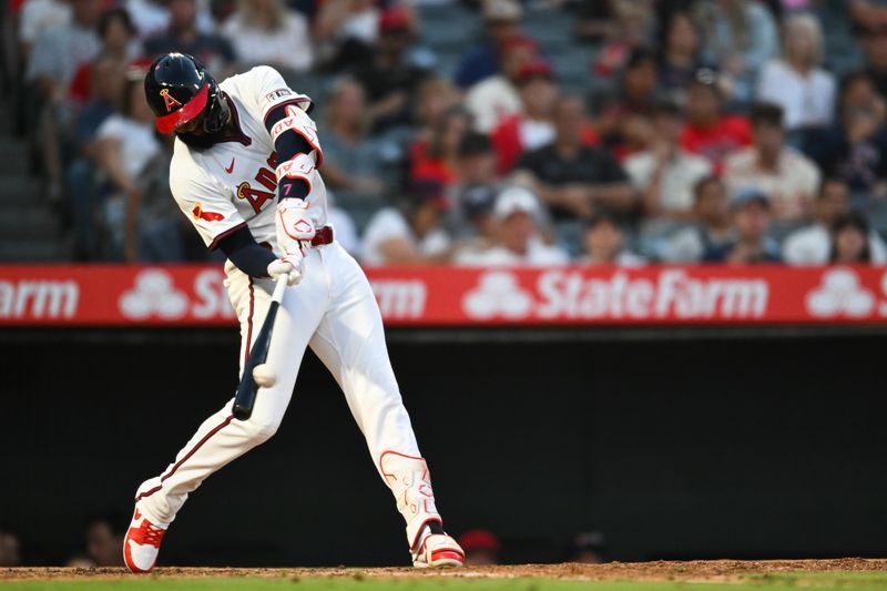 Jul 27, 2024; Anaheim, California, USA; Los Angeles Angels outfielder Jo Adell (7) doubles against the Oakland Athletics during the fifth inning at Angel Stadium. Mandatory Credit: Jonathan Hui-USA TODAY Sports