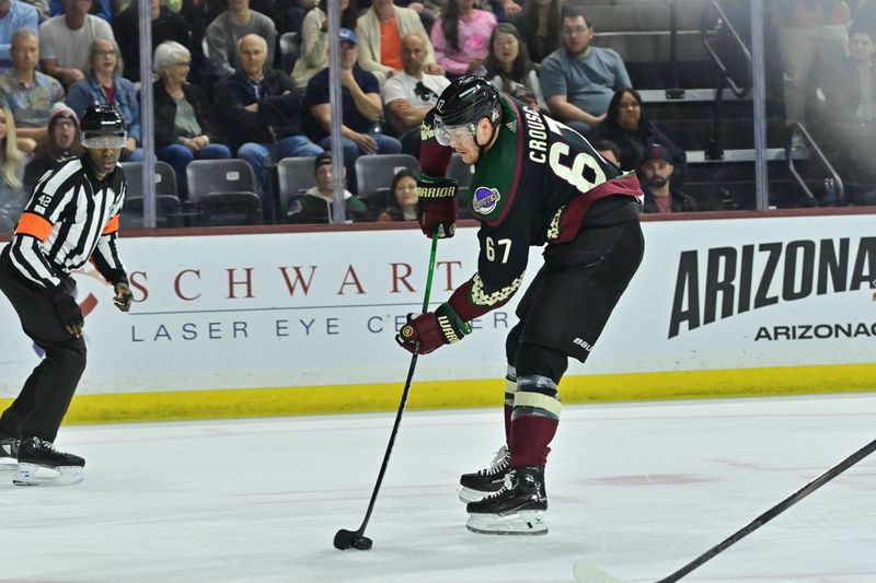 Apr 3, 2024; Tempe, Arizona, USA; Arizona Coyotes left wing Lawson Crouse (67) does a drop pass in the second period against the Vancouver Canucks
 at Mullett Arena. Mandatory Credit: Matt Kartozian-USA TODAY Sports