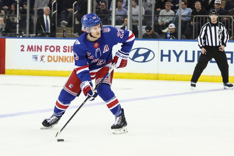 Mar 23, 2026; New York, New York, USA;  New York Rangers defenseman Adam Fox (23) attempts a shot on goal in the first period against the Ottawa Senators at Madison Square Garden. Mandatory Credit: Wendell Cruz-Imagn Images