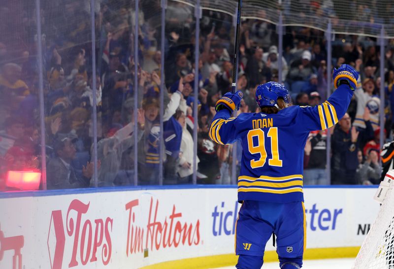 Oct 18, 2025; Buffalo, New York, USA;  Buffalo Sabres right wing Josh Doan (91) reacts after scoring his second goal of the game during the second period against the Florida Panthers at KeyBank Center. Mandatory Credit: Timothy T. Ludwig-Imagn Images